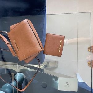Micheal Khors tan crossbag and matching wallet